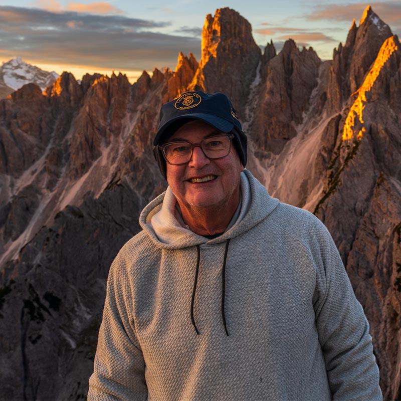 Portrait of a JTO Photography workshop participant with Cadini di Misurina peaks at sunset