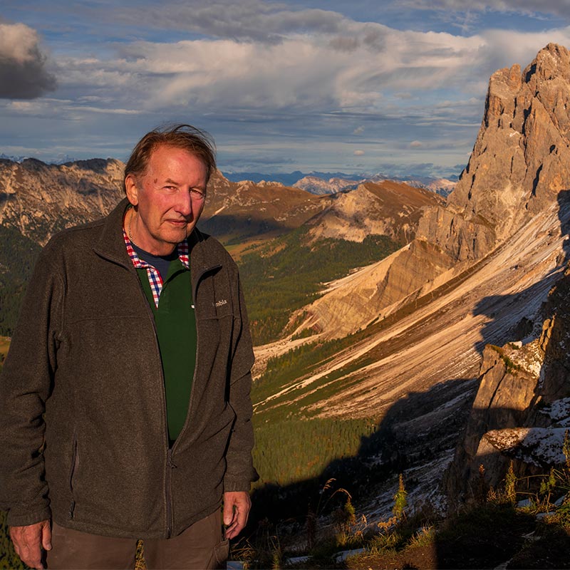 JTO Photography workshop participant standing on the Seceda ridgeline in the Dolomites