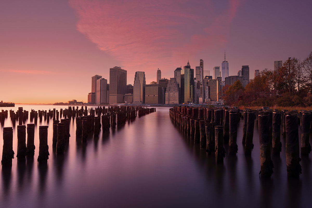 Manhattan skyline at dawn seen from Brooklyn Bridge Park, New York City